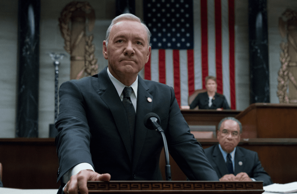 Frank Underwood standing at a podium