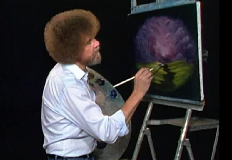 Bob Ross painting a nature scene