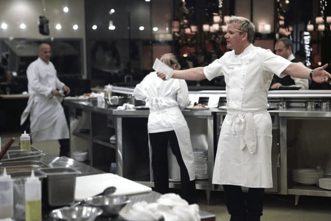 Gordon Ramsay egging on the contestants in the kitchen 