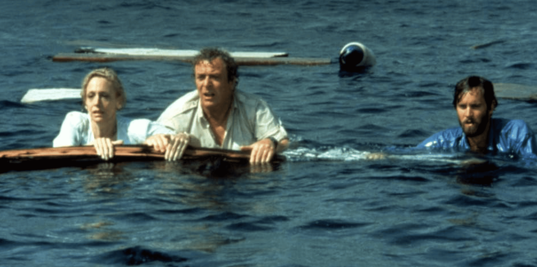 Lorraine Gary, Michael Caine, and Lance Guest swimming adrift in this image from Universal Pictures.