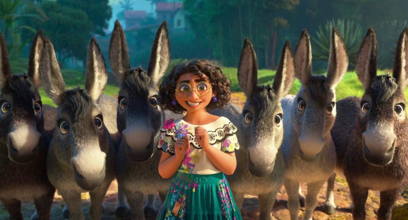 Mirabel Madrigal from the movie Encanto smiling in front of a row of six donkeys