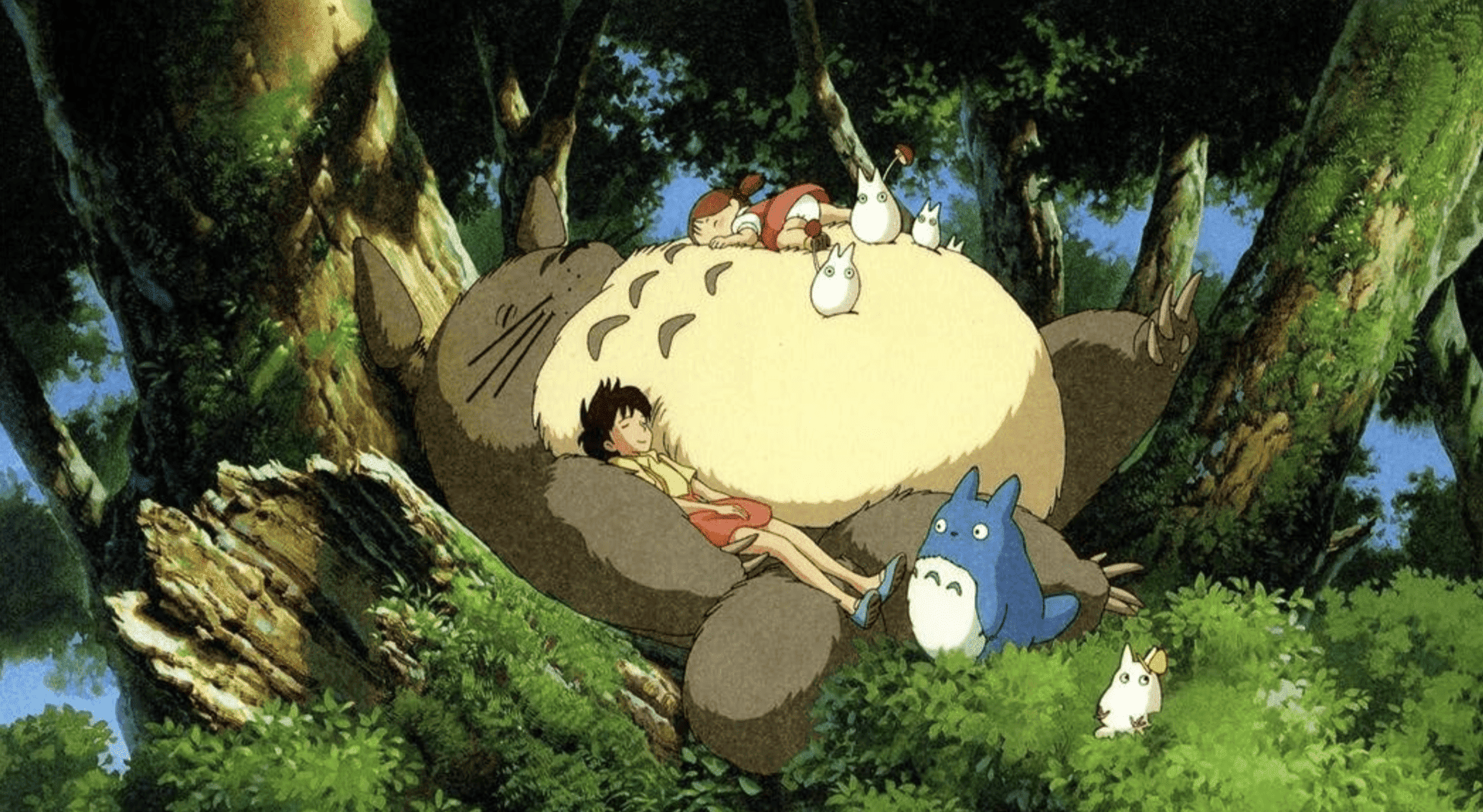 Two kids and half a dozen furry forest sprites take a nap in this still from Studio Ghibli.
