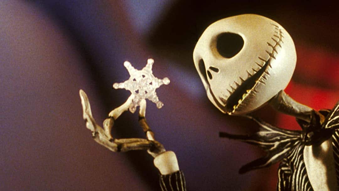 A claymation skeleton sings to a snowflake in this image from Tim Burton Productions.
