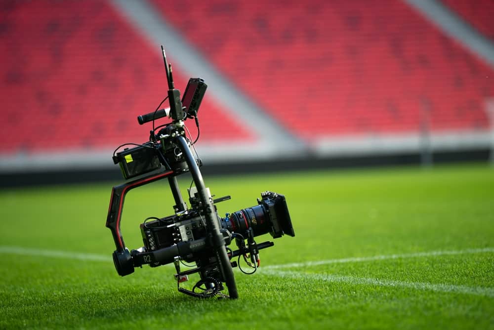 Camera propped up on a football field
