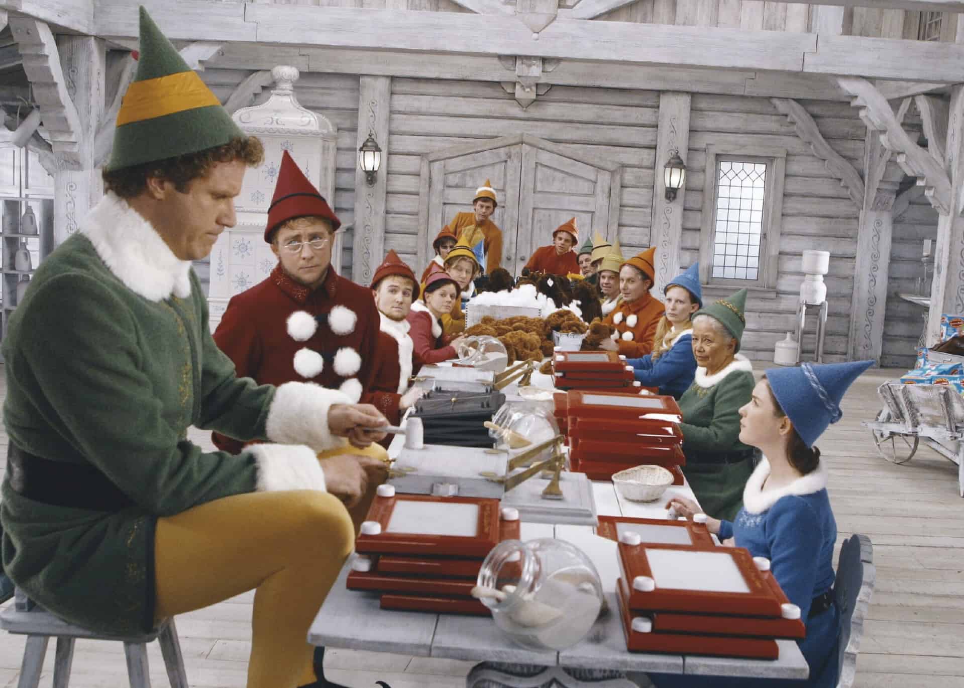 One elf towers over the other elves in Santa’s Workshop in this image from New Line Cinema.