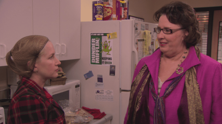 Wearing a hairnet, Angela takes orders from Phyllis