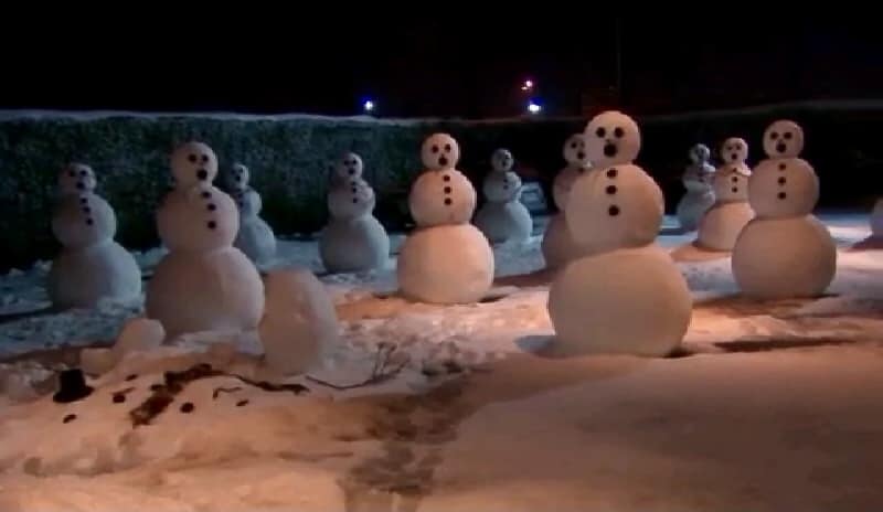 A field of snowmen taunts Jim as he leaves for the day.