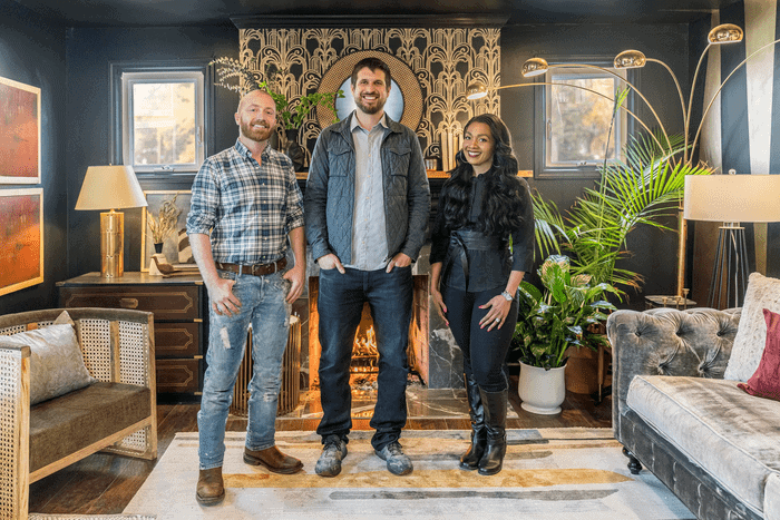 Keith Bynum, Evan Thomas, and Shea Hicks-Whitfield standing in a living room