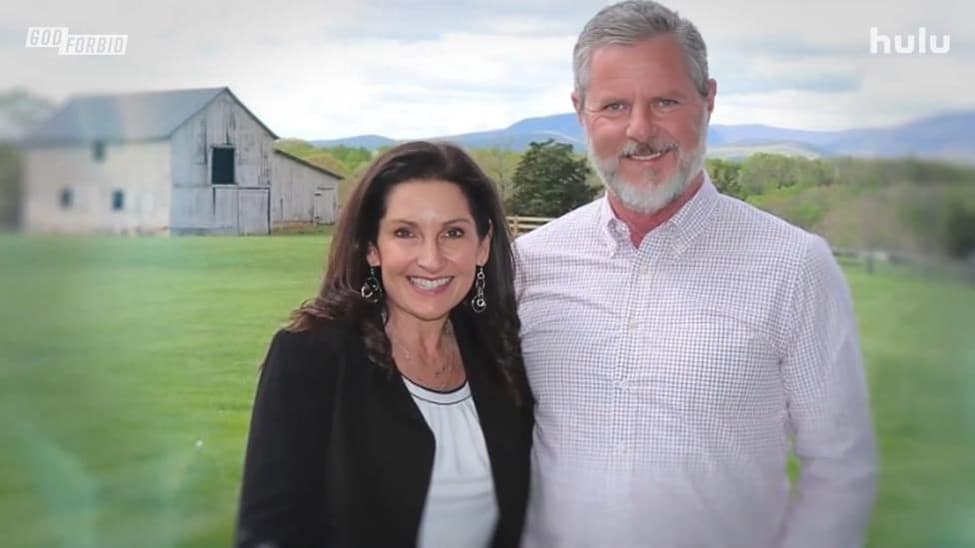 Becki and Jerry Falwell smiling in front of a barn