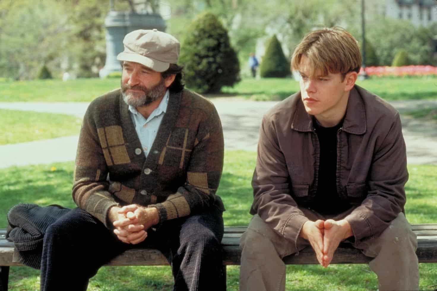 Sean and Will sitting on a park bench in the movie Good Will Hunting
