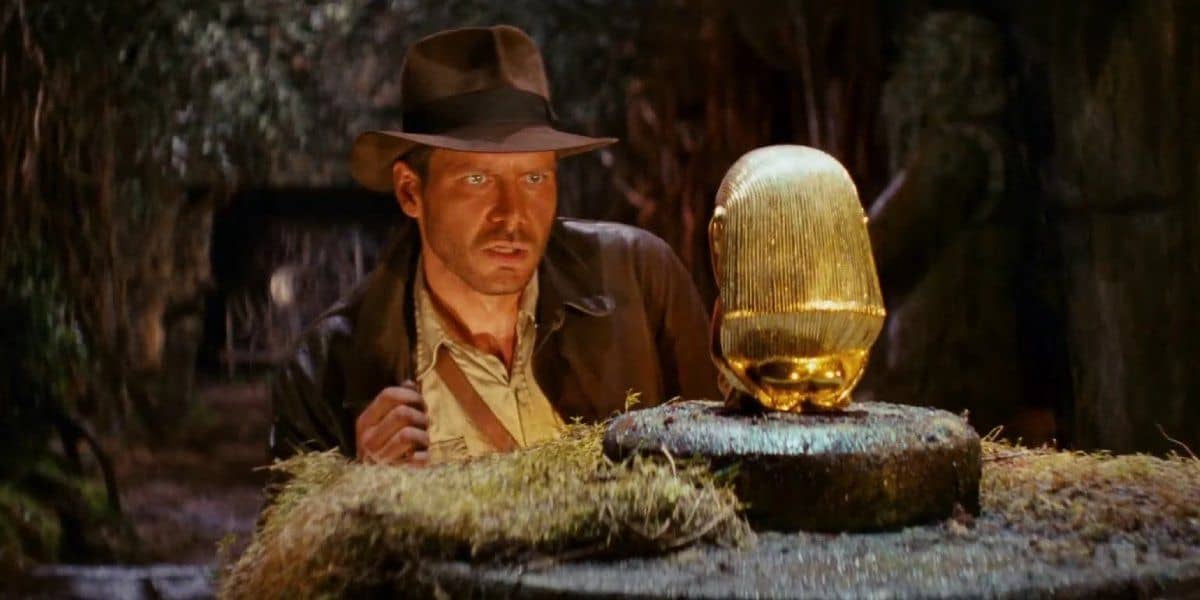 An adventurer admires a golden idol in this image from Lucasfilm.