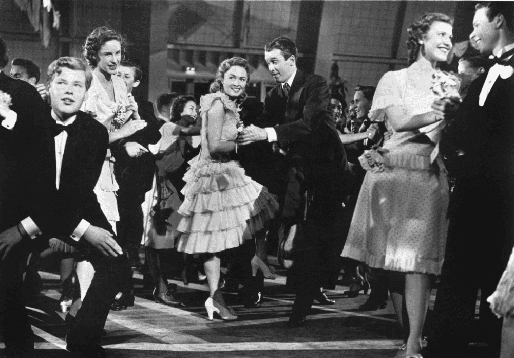  A holiday party with adults dancing together in this image from Liberty Films (II). 