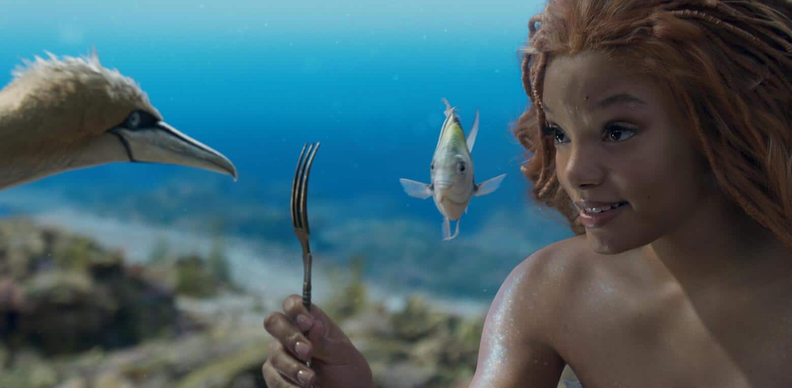 A mermaid shows a fork to a bird in this photo from Walt Disney Pictures.