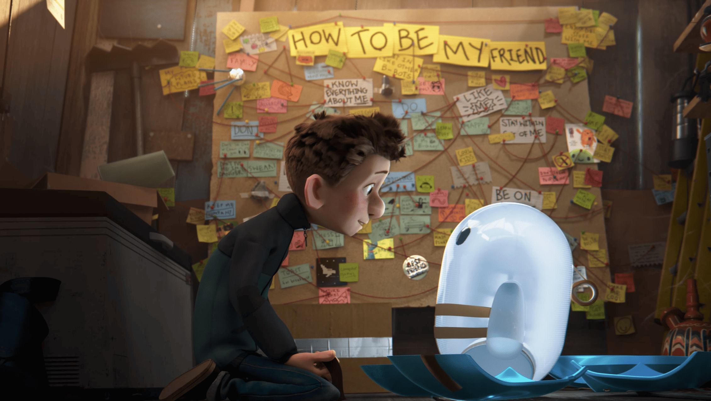  A boy and his robot study a corkboard covered in notes and string in this image from 20th Century Fox. 