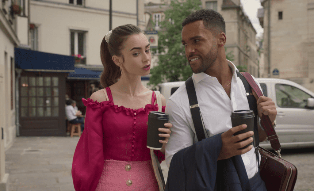 Emily and Alfie walk together and drink coffee.