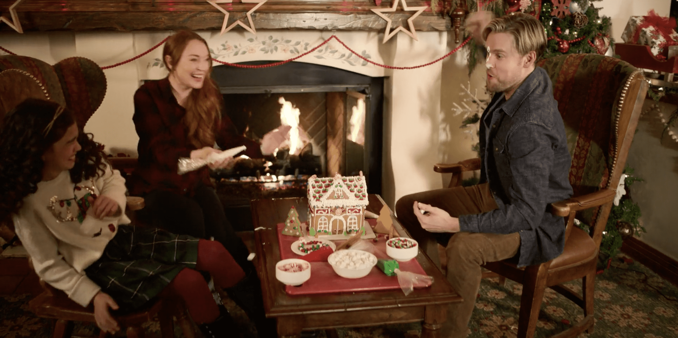 Jake and Sierra having a food fight in a carpeted room