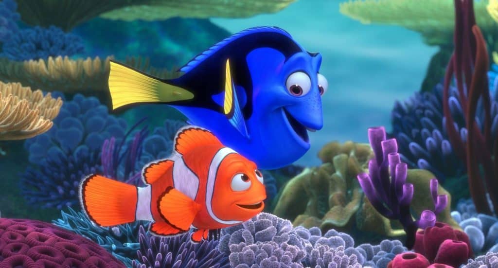 Marlin and Dory smiling and swimming in a reef