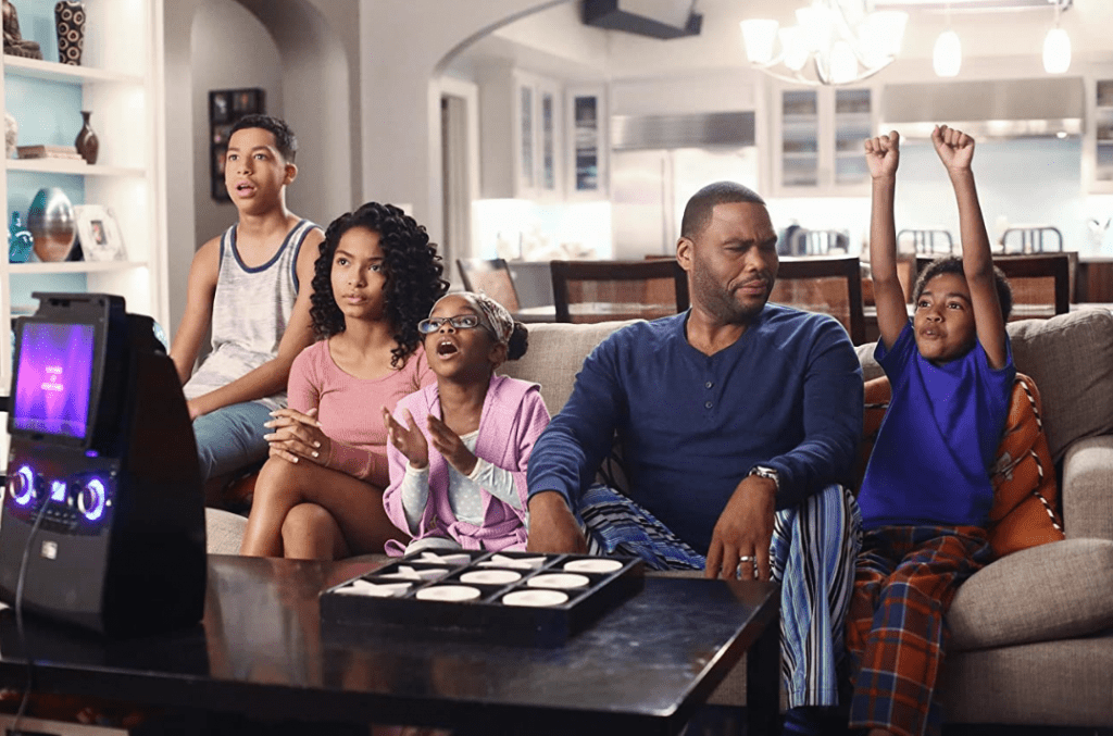 The Johnson family sharing mixed emotions as Bow (Tracee Ellis Ross) sings to them offscreen