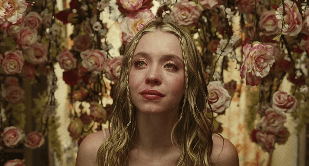 Cassie Howard from “Euphoria” crying with roses hanging around her