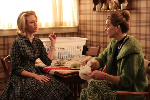 Betty and Francine smoking cigarettes and chatting at the kitchen table