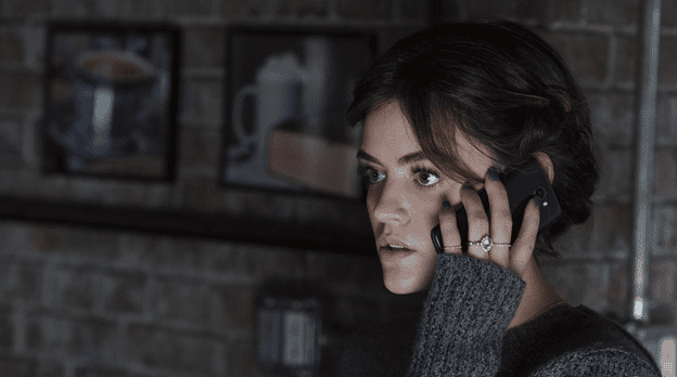 Lucy Hale listening on cell phone
