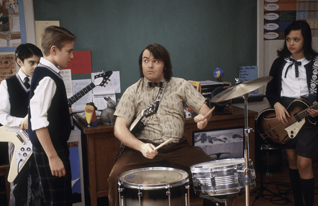 Jack Black on the drums with his students watching