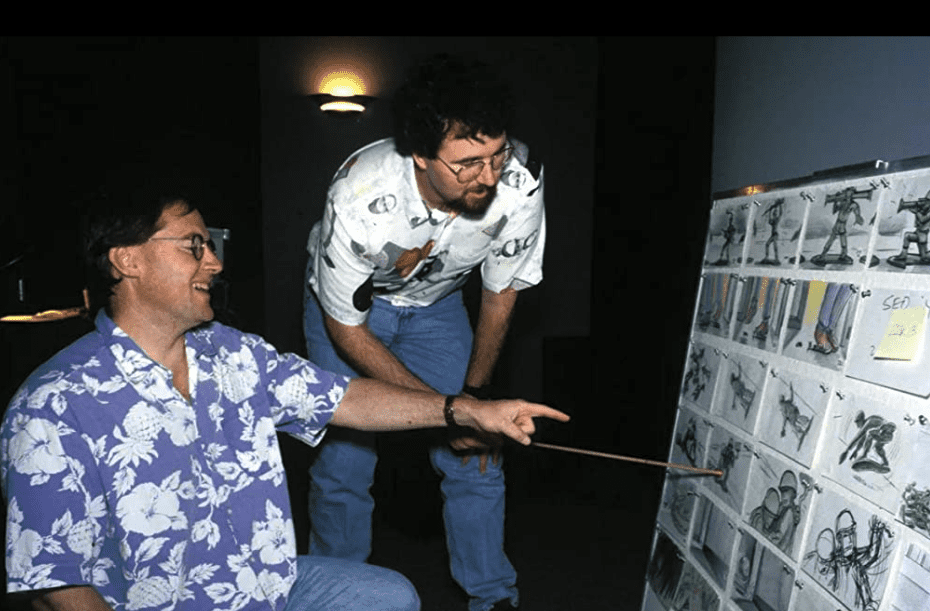 Animation pioneers confer over a storyboard 