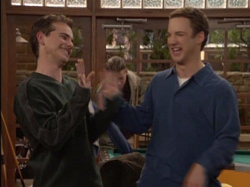 Shawn and Cory high-fiving in a cafe