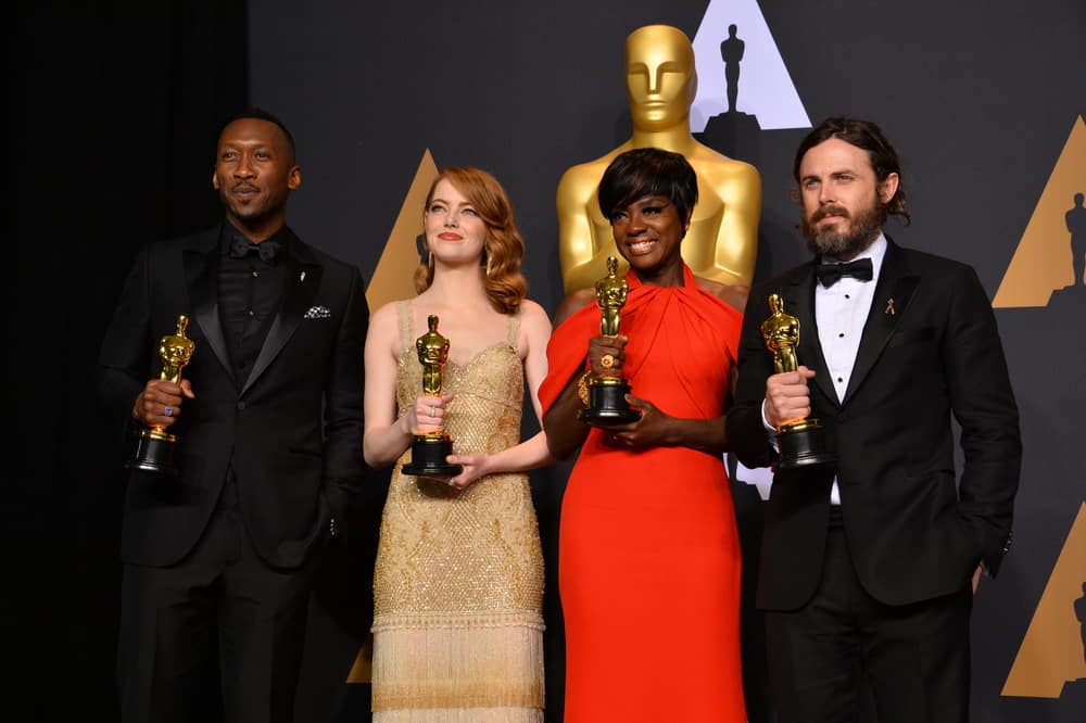Mahershala Ali, Emma Stone, Viola Davis, and Casey Affleck show off their Academy Awards on the red carpet.