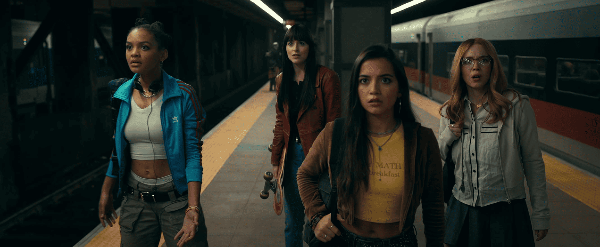 A group of women stand on a train platform in this image from Columbia Pictures. 