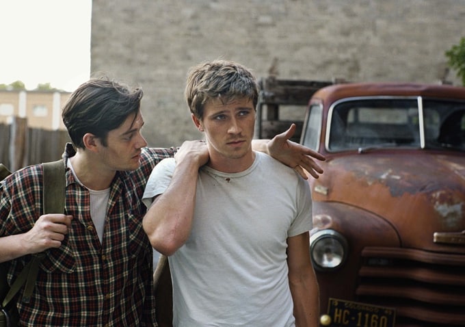 Sal and Dean conferring in front of their rusted pickup truck