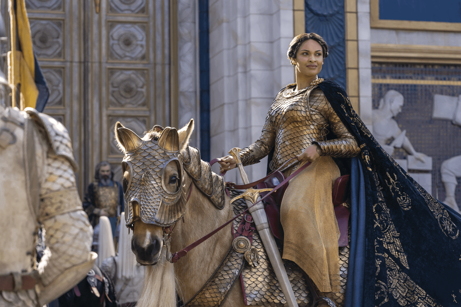 Míriel wearing gold armor and riding a royal horse