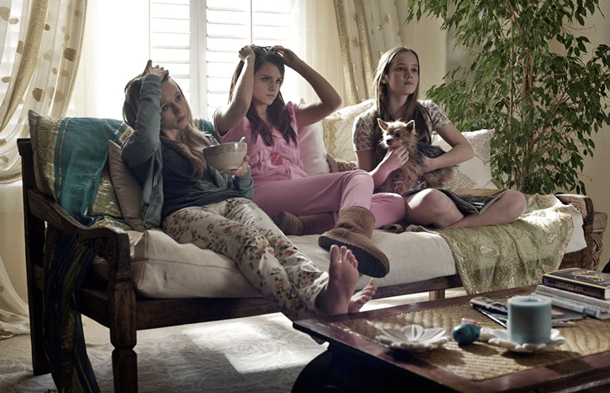 Sam, Nicki, and Emily enjoy a lazy afternoon on the couch together