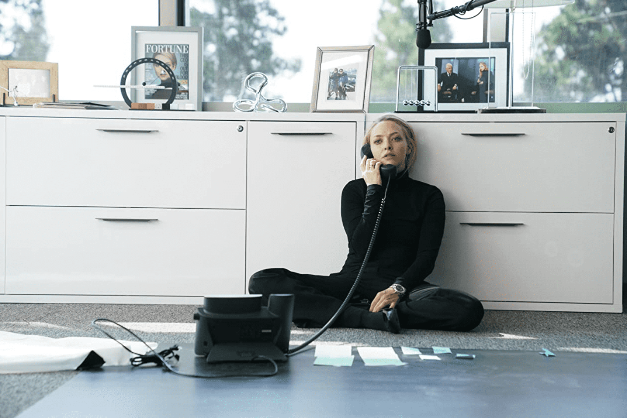 Elizabeth sits on the floor with notes spread out around her