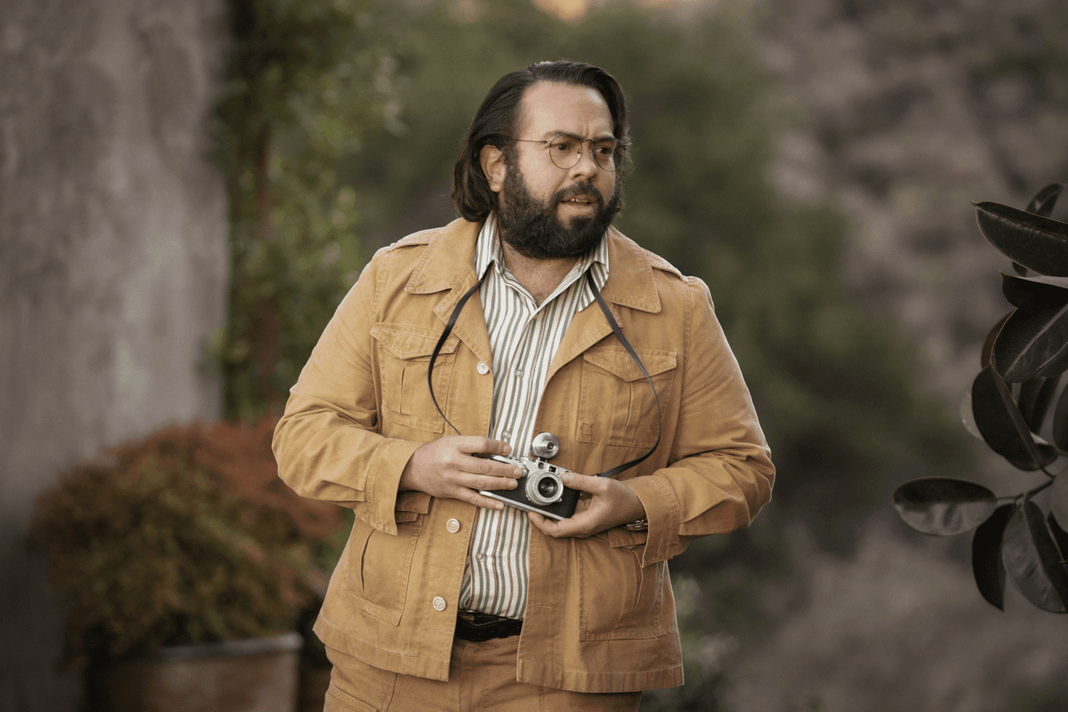 Francis Ford Coppola looking focused with a film camera