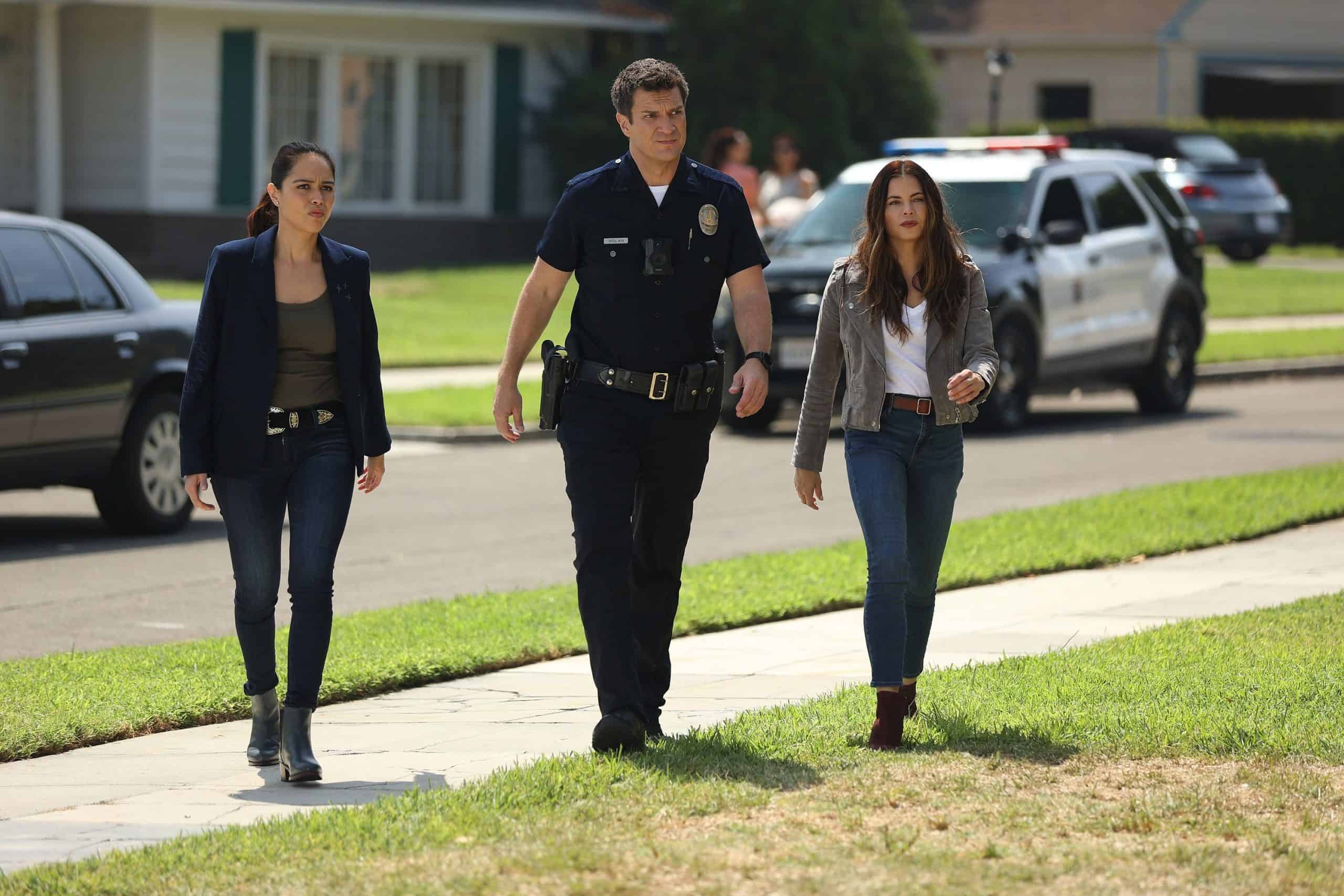 Lopez, Nolan, and Bailey approach a torched house.