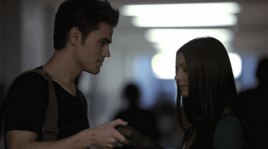  Stefan gives Elena an old book.