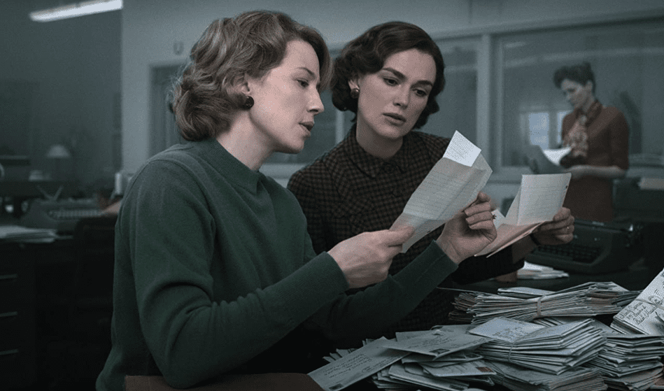 Two women examine letters together in this image from Hulu