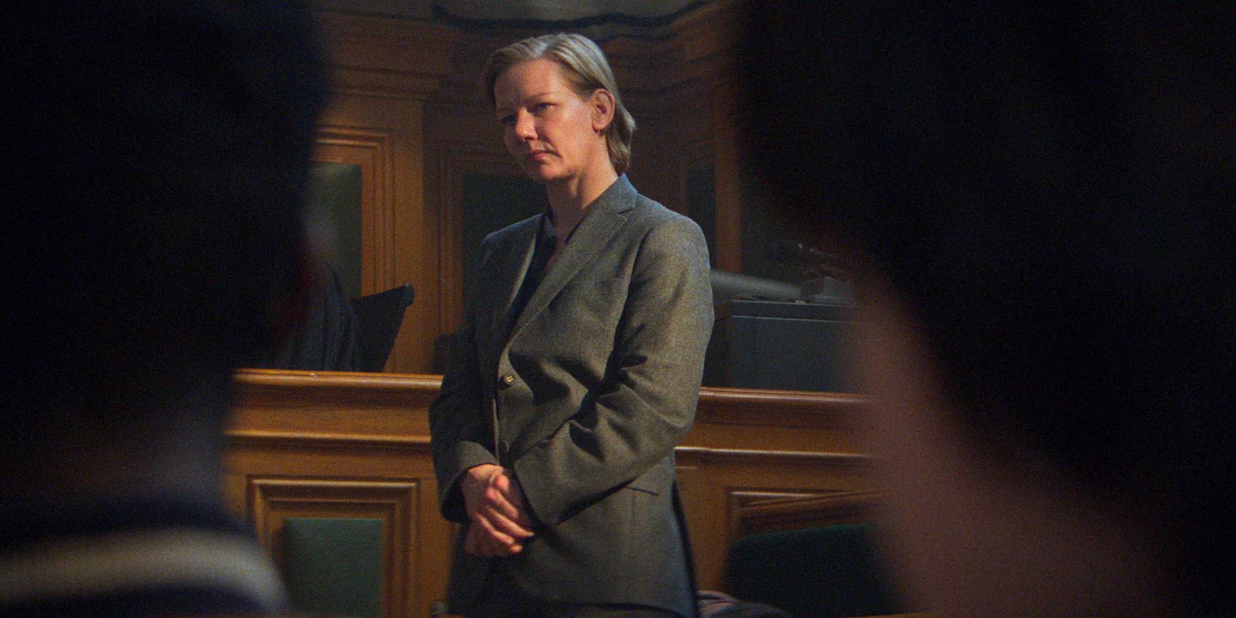 A woman stands in a courtroom in this image from Canal+. 
