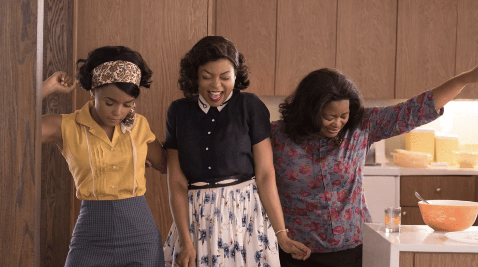 Three Black women celebrate together in this photo from Disney Plus.