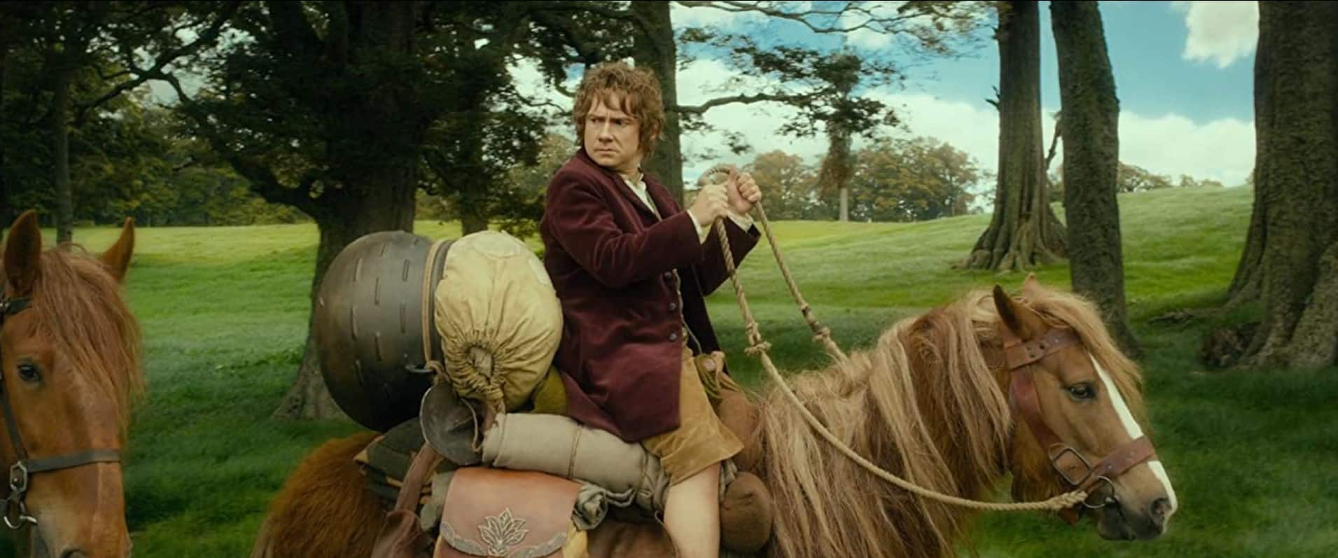 A hobbit rides a pony in this image from HBO Max 