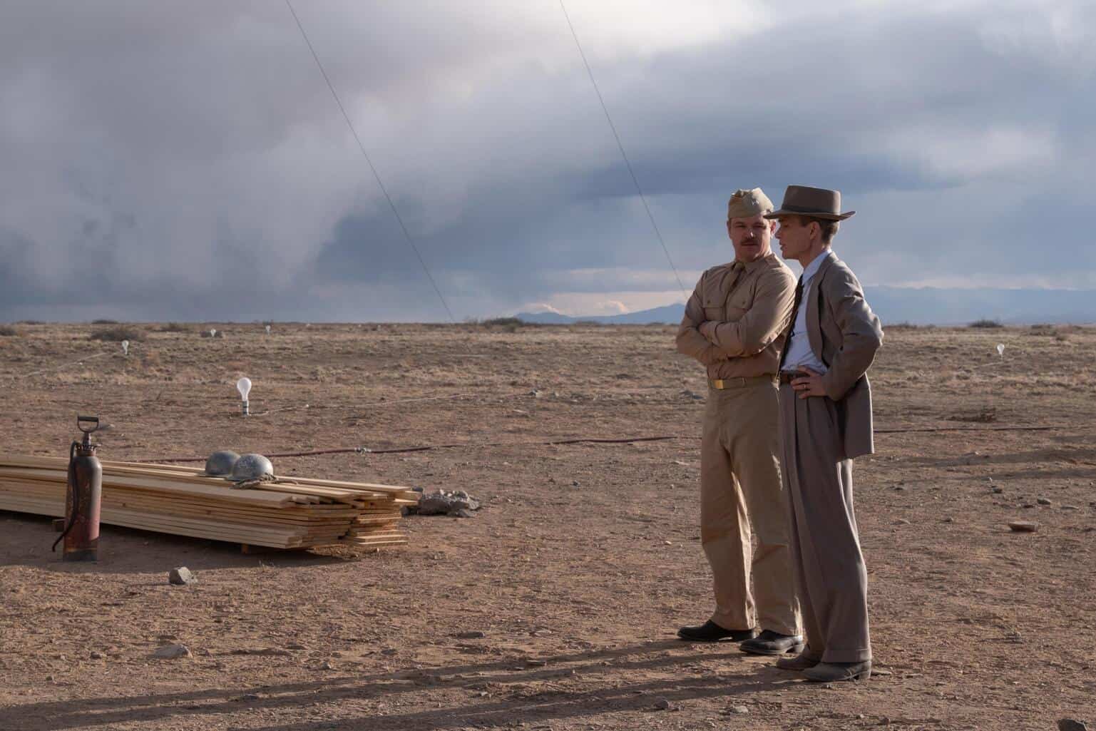 Two military men stand near a desert building site in this image from Universal Pictures.