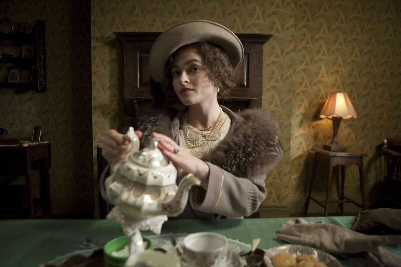 A woman in vintage clothing serving tea in this photo from the Weinstein Company.