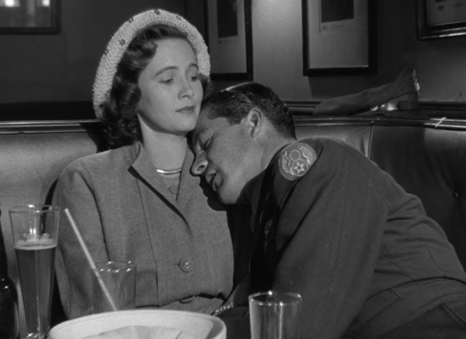 soldier cries on a woman’s shoulder in a diner booth in this photo from The Samuel Goldwyn Company.
