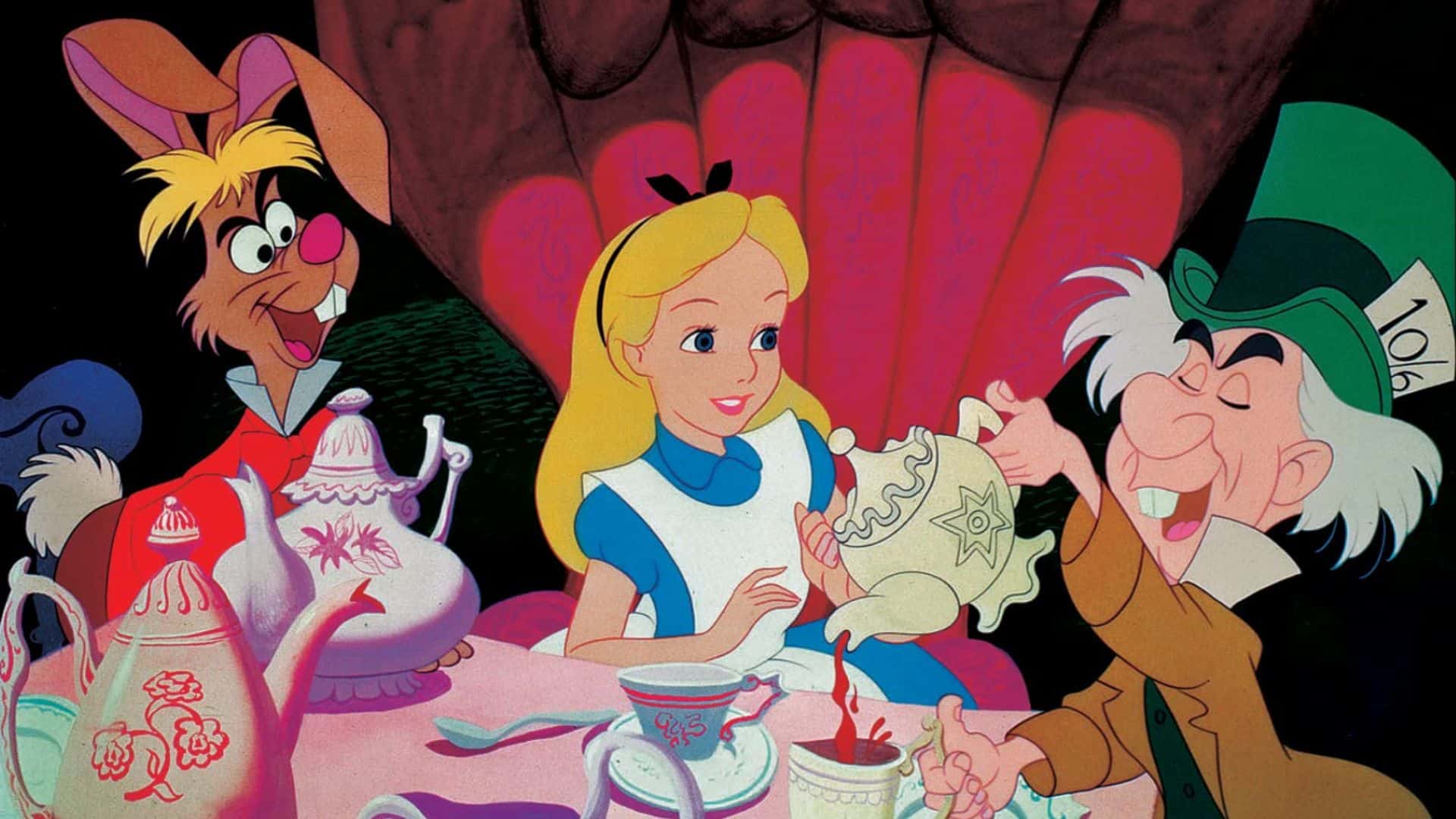 The March Hare, Alice, and the Mad Hatter enjoy a mad tea party in this image from Disney Plus.