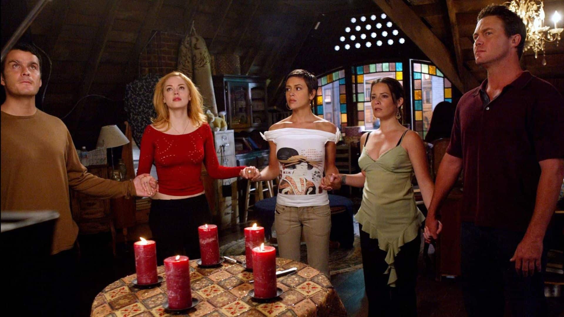 Richard Montana, Paige Matthews, Phoebe Halliwell, Piper Halliwell, and Leo Wyatt cast a spell in this image from Hulu.