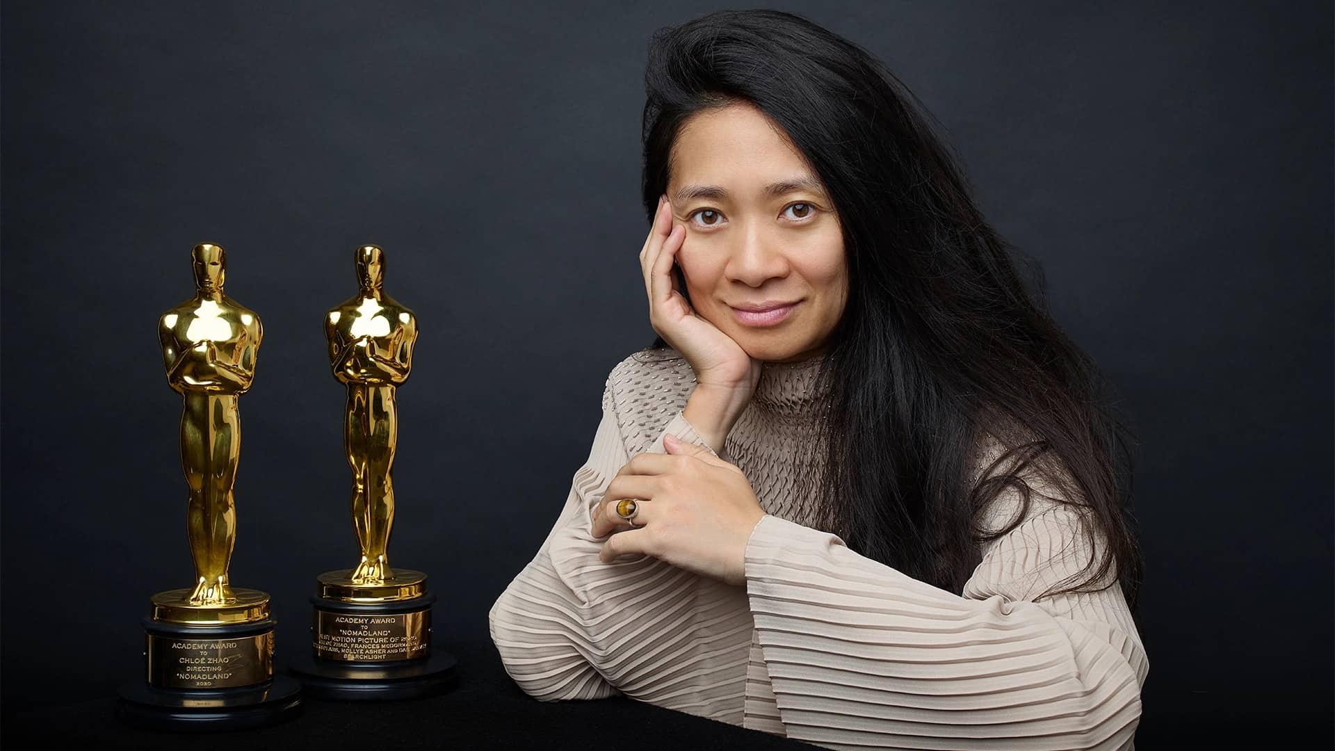 Chloé sits with her two SAG trophies in this image from Andrew Eccles