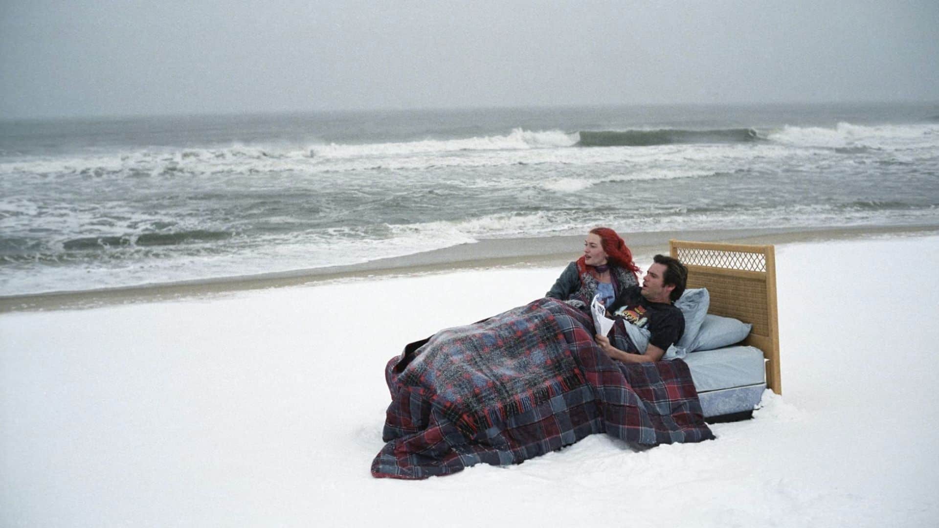 Clementine and Joel in a bed on the beach in this image from Amazon Prime Video