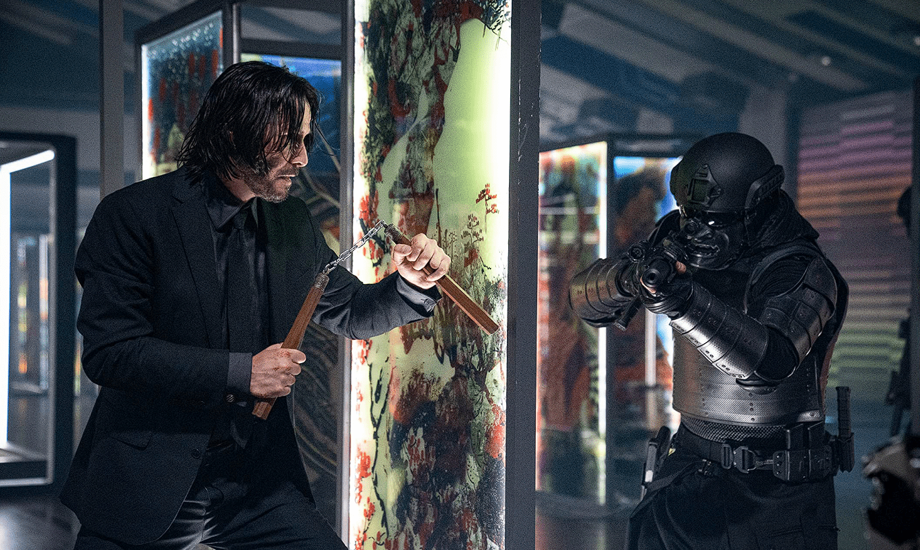 Keanu Reeves holding nunchucks in this image from Lionsgate Films