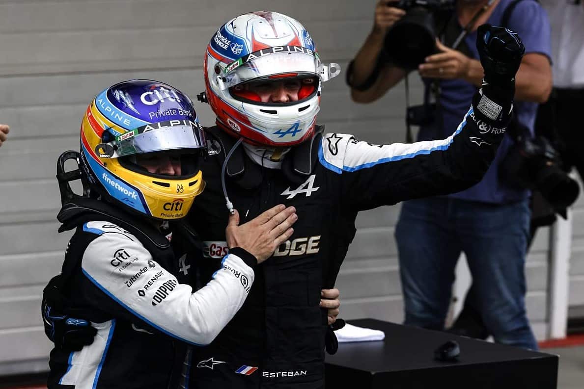 Two racing drivers celebrate in this image from Netflix